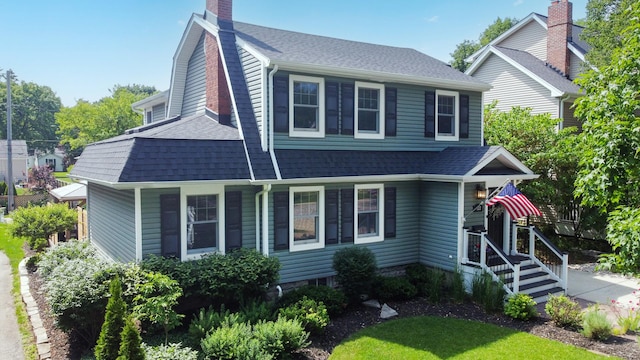 122 Logan Ave, Geneva, IL 60134 - view of front of property with a shingled roof and a chimney