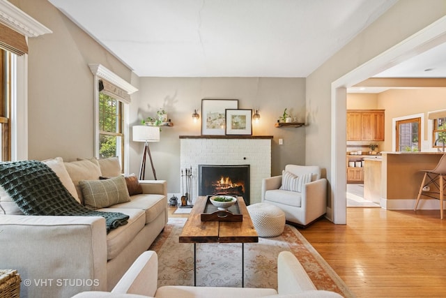 122 Logan Ave, Geneva, IL 60134 - living room with light wood-style floors and a fireplace