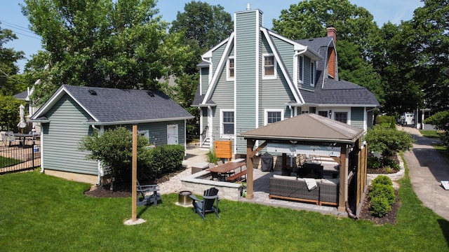 122 Logan Ave, Geneva, IL 60134 - rear view of house featuring a chimney, a gazebo, a patio, and an outdoor structure