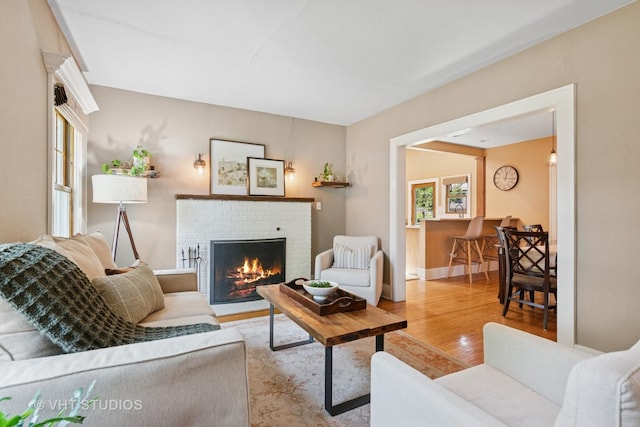 122 Logan Ave, Geneva, IL 60134 - living area with a brick fireplace and wood finished floors