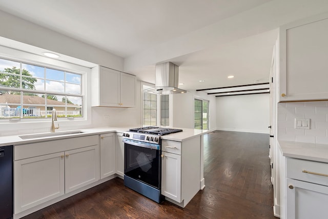 1100 Leicester Rd, Elk Grove Village, IL 60007 - kitchen featuring stainless steel gas stove, island exhaust hood, a peninsula, backsplash, and light countertops