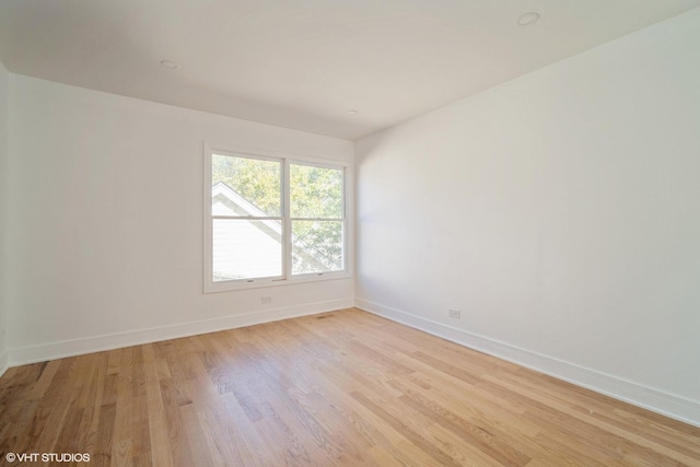 823 Suffield Sq, Lincolnshire, IL 60069 - empty room featuring baseboards and light wood finished floors