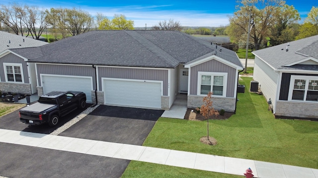 946 Partridge Cir, Marengo, IL 60152 - ranch-style home with a garage, central AC, stone siding, a shingled roof, and driveway