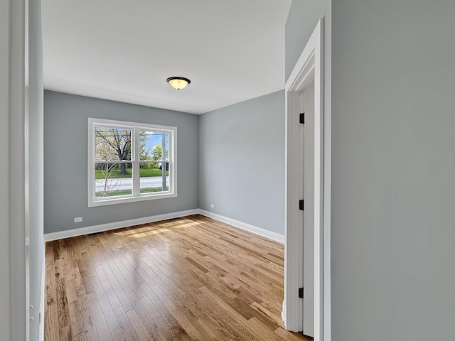 946 Partridge Cir, Marengo, IL 60152 - empty room featuring baseboards and wood finished floors