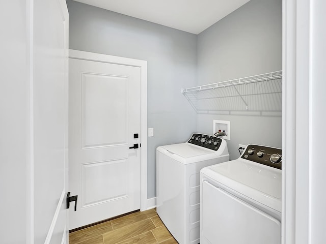946 Partridge Cir, Marengo, IL 60152 - washroom with independent washer and dryer, laundry area, baseboards, and light wood-type flooring