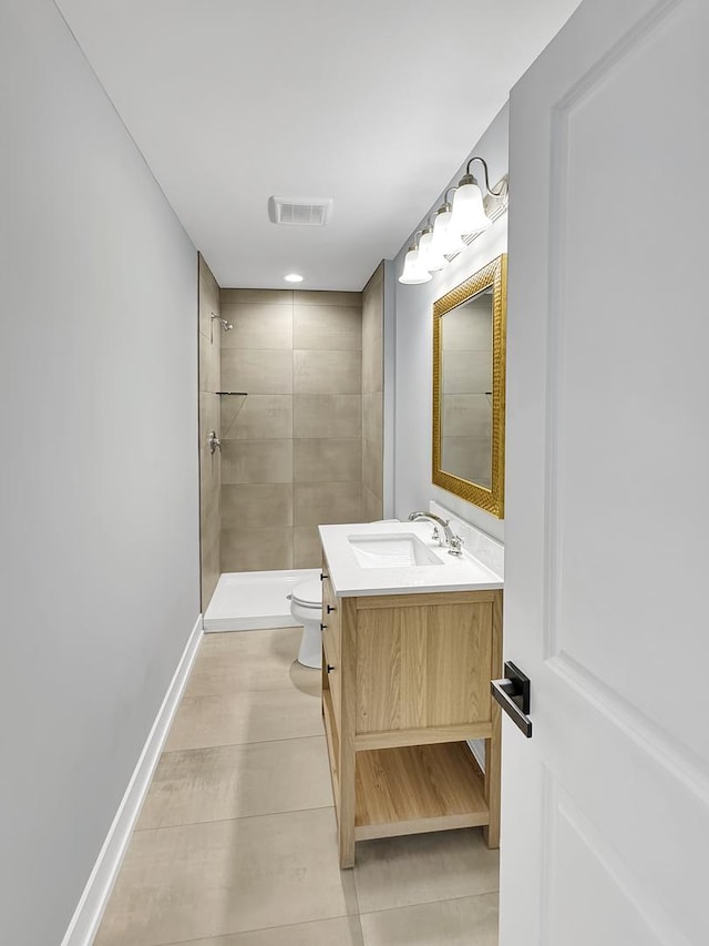 946 Partridge Cir, Marengo, IL 60152 - full bath featuring visible vents, tile patterned flooring, vanity, toilet, and tiled shower