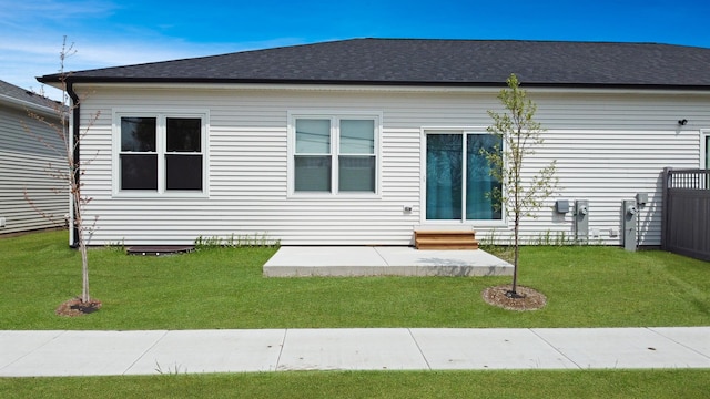 946 Partridge Cir, Marengo, IL 60152 - rear view of property with a lawn, a patio, a shingled roof, and entry steps