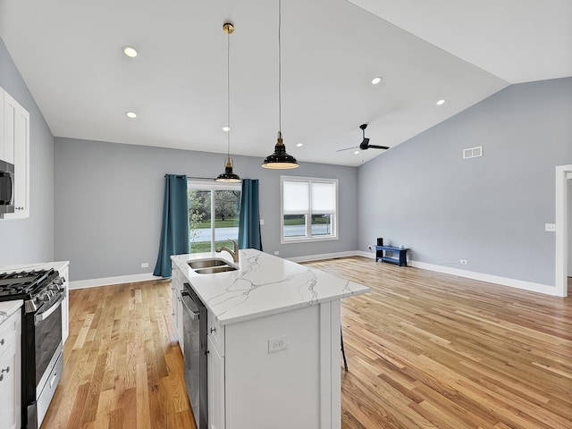 946 Partridge Cir, Marengo, IL 60152 - kitchen featuring visible vents, light wood-type flooring, a sink, appliances with stainless steel finishes, and vaulted ceiling