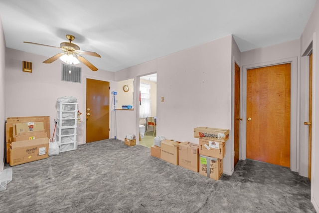 interior space with visible vents, carpet, and ceiling fan
