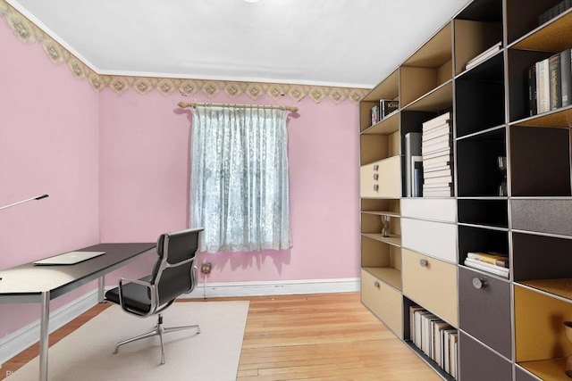 home office featuring light wood-type flooring and baseboards