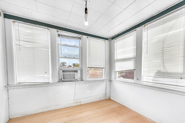 unfurnished sunroom with cooling unit