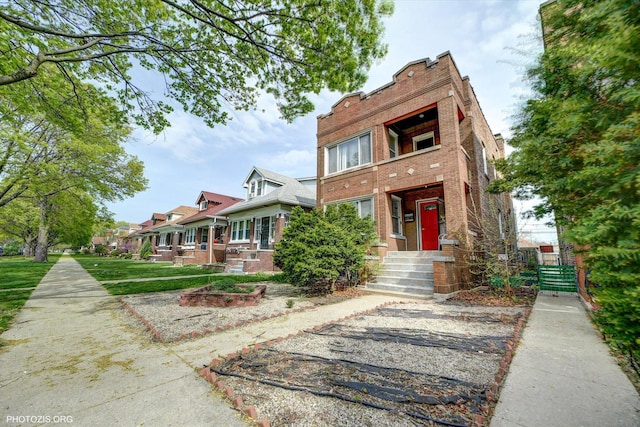 view of front of house featuring brick siding