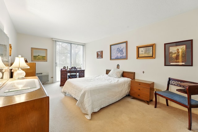 bedroom with light carpet and access to outside