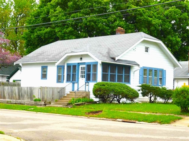 1602 Price St, Rockford, IL 61103 - view of front of house with a chimney and roof with shingles