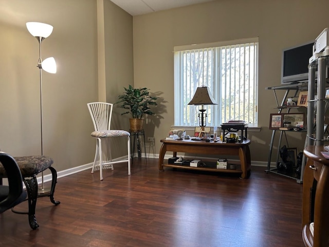 sitting room with wood finished floors and baseboards
