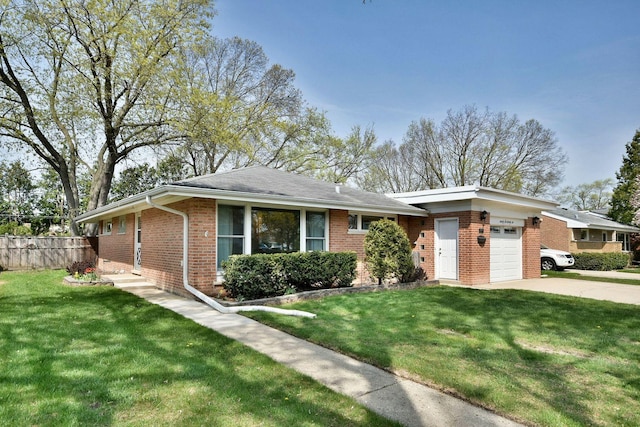 view of front of house featuring brick siding, a front lawn, an attached garage, and driveway