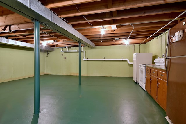 unfinished below grade area with freestanding refrigerator