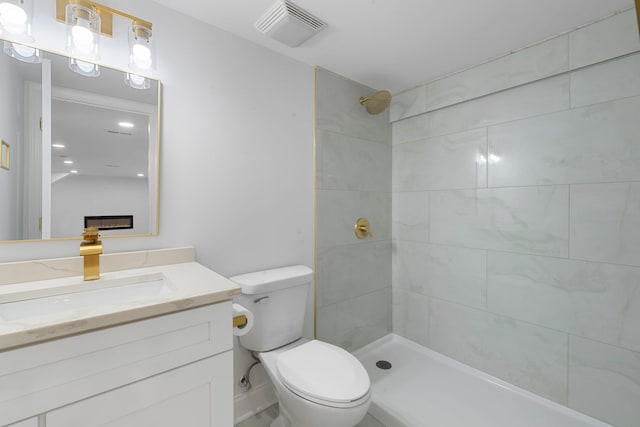 9048 Oneill Dr, Burr Ridge, IL 60527 - full bathroom with vanity, a tile shower, toilet, and visible vents