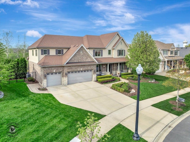 16650 W Merc Ln, Lockport, IL 60441 - view of front facade featuring fence, covered porch, concrete driveway, and a front lawn