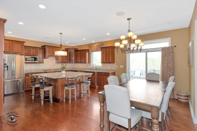 dining space with recessed lighting, a chandelier, and dark wood-style floors