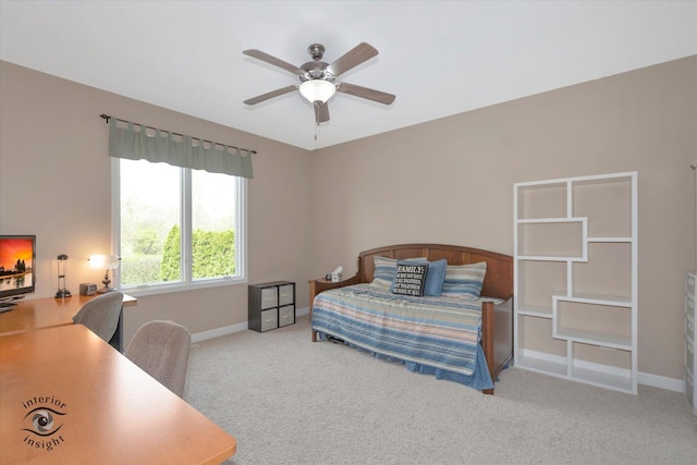 carpeted bedroom with baseboards and ceiling fan