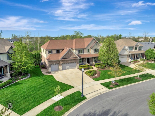 view of front facade with a front lawn, stone siding, concrete driveway, an attached garage, and a residential view
