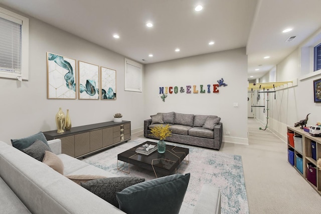 living room with baseboards, carpet flooring, recessed lighting, and visible vents