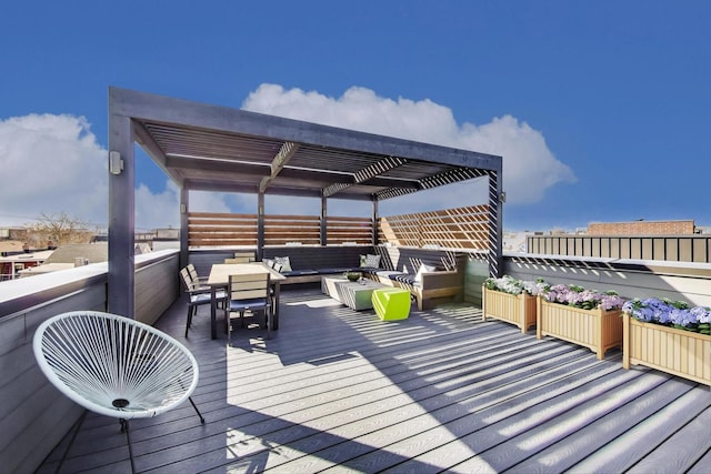 wooden terrace featuring a pergola and an outdoor living space