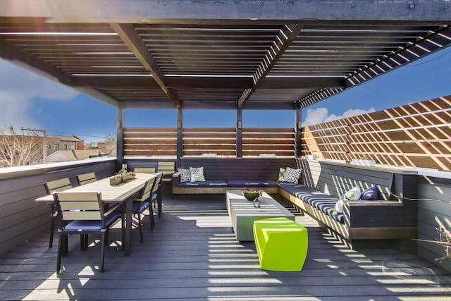 wooden deck featuring outdoor dining area and an outdoor living space