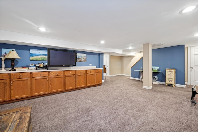 214 E Woodland Rd E, Lake Bluff, IL 60044 - unfurnished living room with baseboards, carpet, and recessed lighting