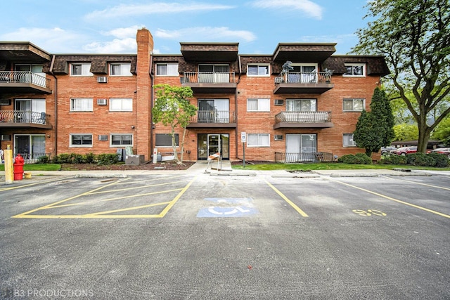 2345 185th Ct Unit 25, Lansing, IL 60438 - view of property featuring uncovered parking