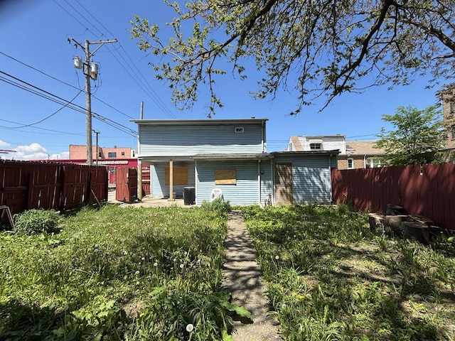 2342 W 72nd St, Chicago, IL 60636 - back of property with fence and central air condition unit