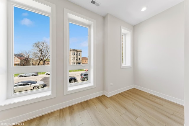 interior space with visible vents, recessed lighting, baseboards, and wood finished floors