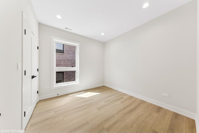 unfurnished bedroom featuring baseboards, recessed lighting, light wood-style flooring, and visible vents