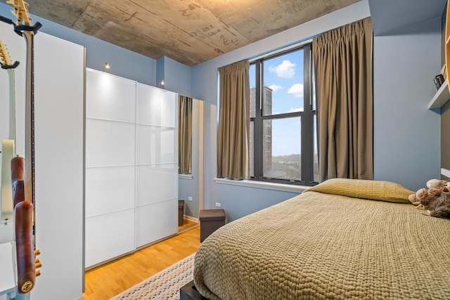 bedroom with wood finished floors