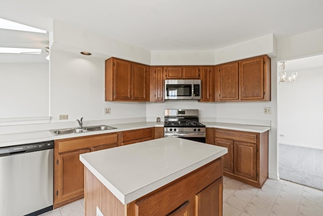 14 Mckinley Ln, Streamwood, IL 60107 - kitchen with brown cabinets, appliances with stainless steel finishes, a sink, and light countertops