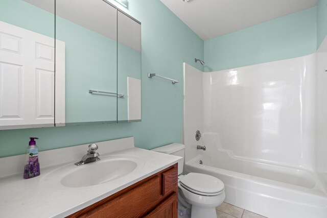 14 Mckinley Ln, Streamwood, IL 60107 - bathroom featuring vanity, tile patterned flooring, bathtub / shower combination, and toilet
