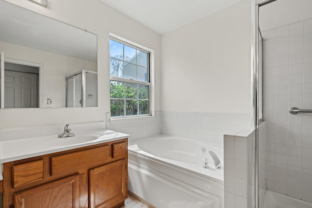 14 Mckinley Ln, Streamwood, IL 60107 - full bathroom with vanity, a garden tub, and a stall shower