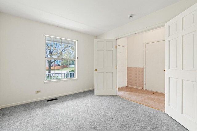 14 Mckinley Ln, Streamwood, IL 60107 - unfurnished bedroom featuring baseboards, carpet, and visible vents