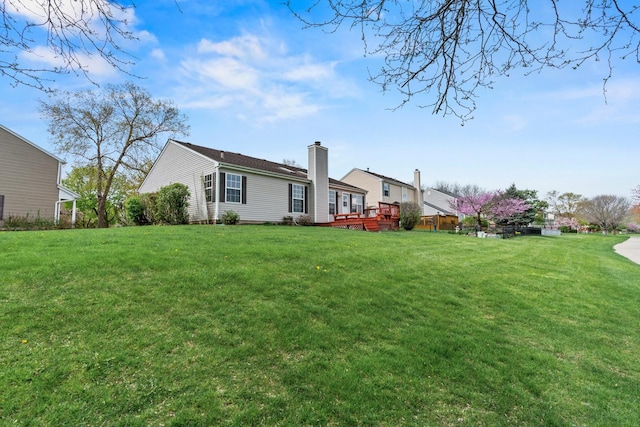 14 Mckinley Ln, Streamwood, IL 60107 - back of house with a lawn and a deck