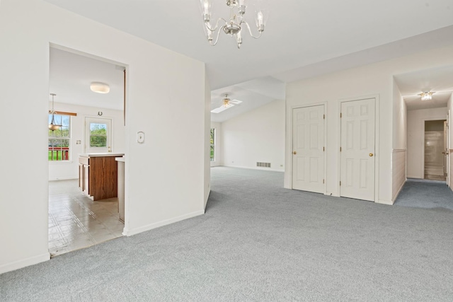 14 Mckinley Ln, Streamwood, IL 60107 - unfurnished room with baseboards, light colored carpet, visible vents, and ceiling fan with notable chandelier