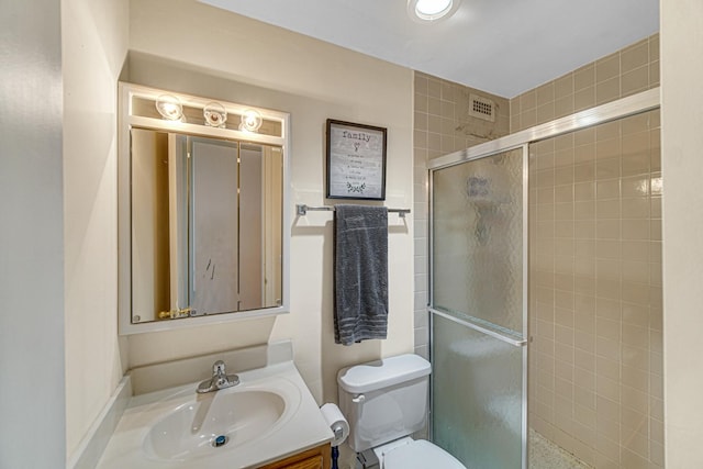 2901 S Michigan Ave Unit 1702, Chicago, IL 60616 - bathroom featuring vanity, a shower stall, toilet, and visible vents