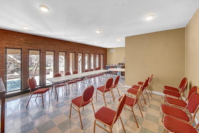 2901 S Michigan Ave Unit 1702, Chicago, IL 60616 - dining room featuring baseboards, recessed lighting, brick wall, and a healthy amount of sunlight