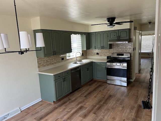 kitchen with stainless steel gas range oven, ceiling fan, dishwasher, a sink, and visible vents