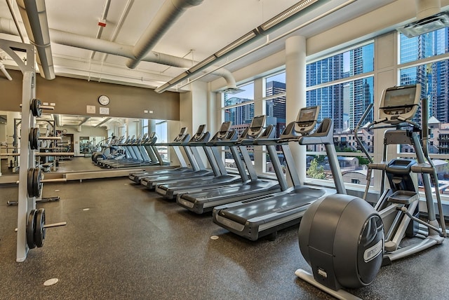 workout area featuring a view of city