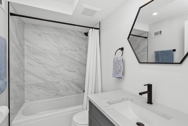full bathroom with vanity, toilet, visible vents, and shower / tub combo