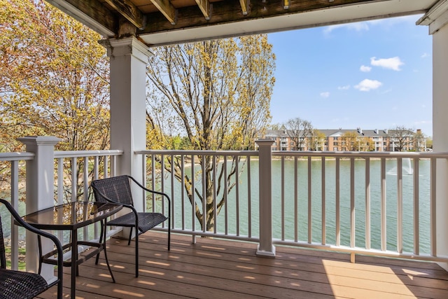 deck featuring a water view