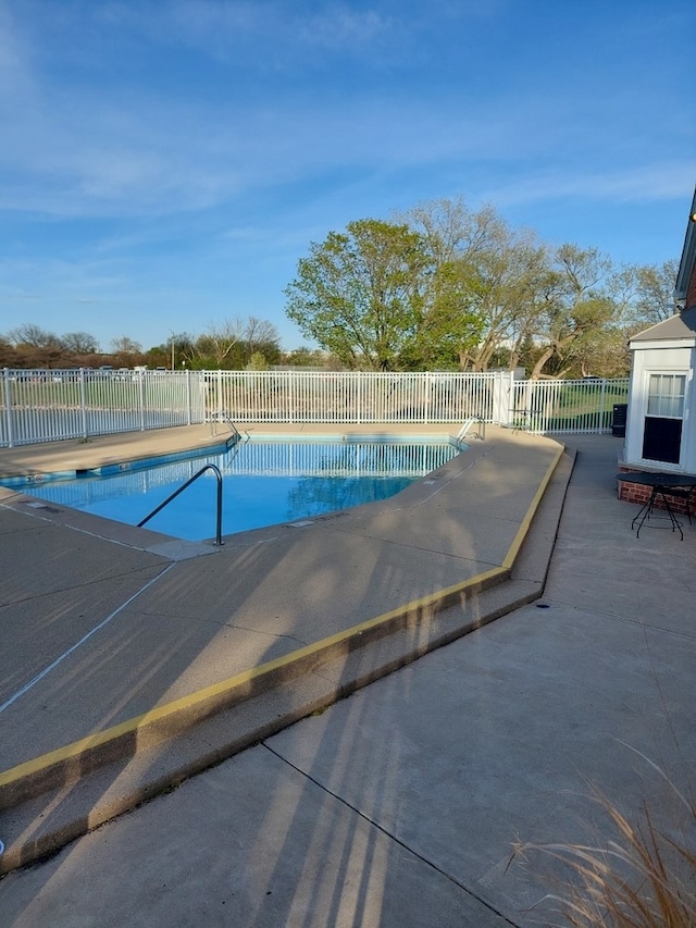 view of swimming pool with a fenced in pool, a patio area, and fence