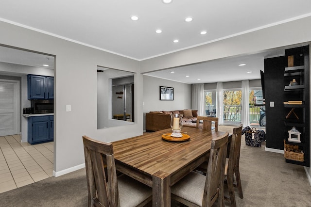 dining space featuring recessed lighting, baseboards, light colored carpet, and ornamental molding