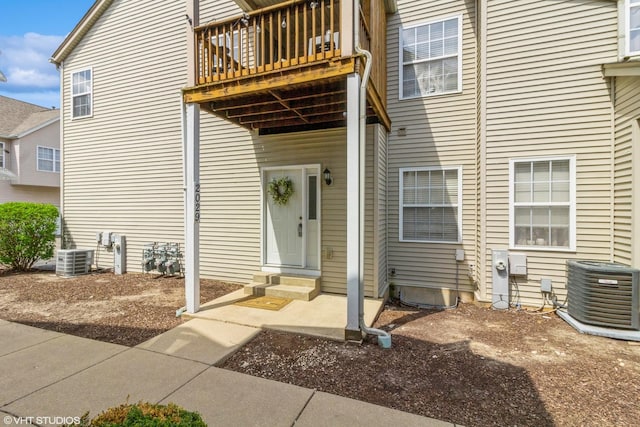 property entrance with central AC and a balcony